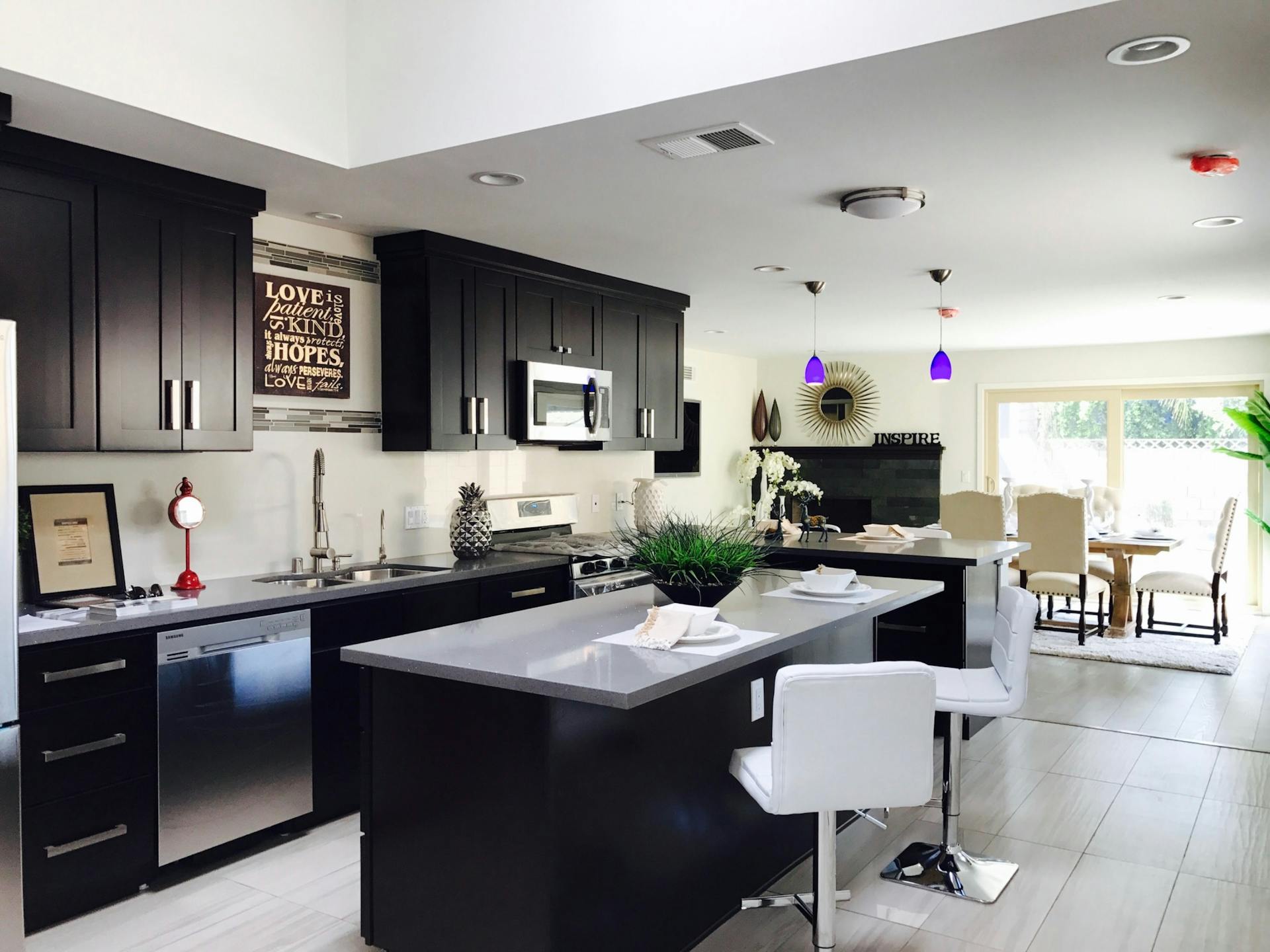 Luxury kitchen with custom cabinetry and stone countertops