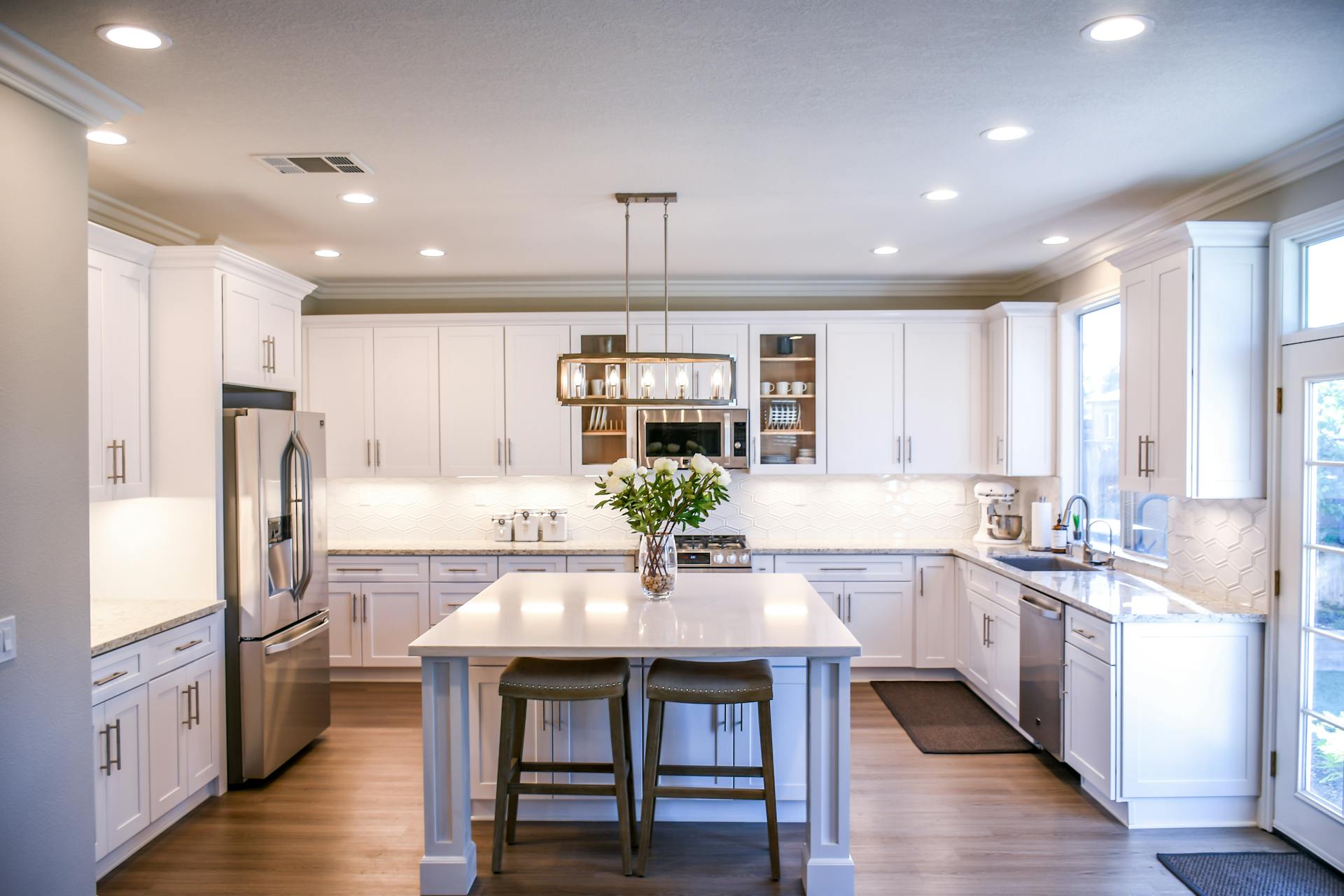 Modern kitchen with island, pendant lighting, and premium appliances