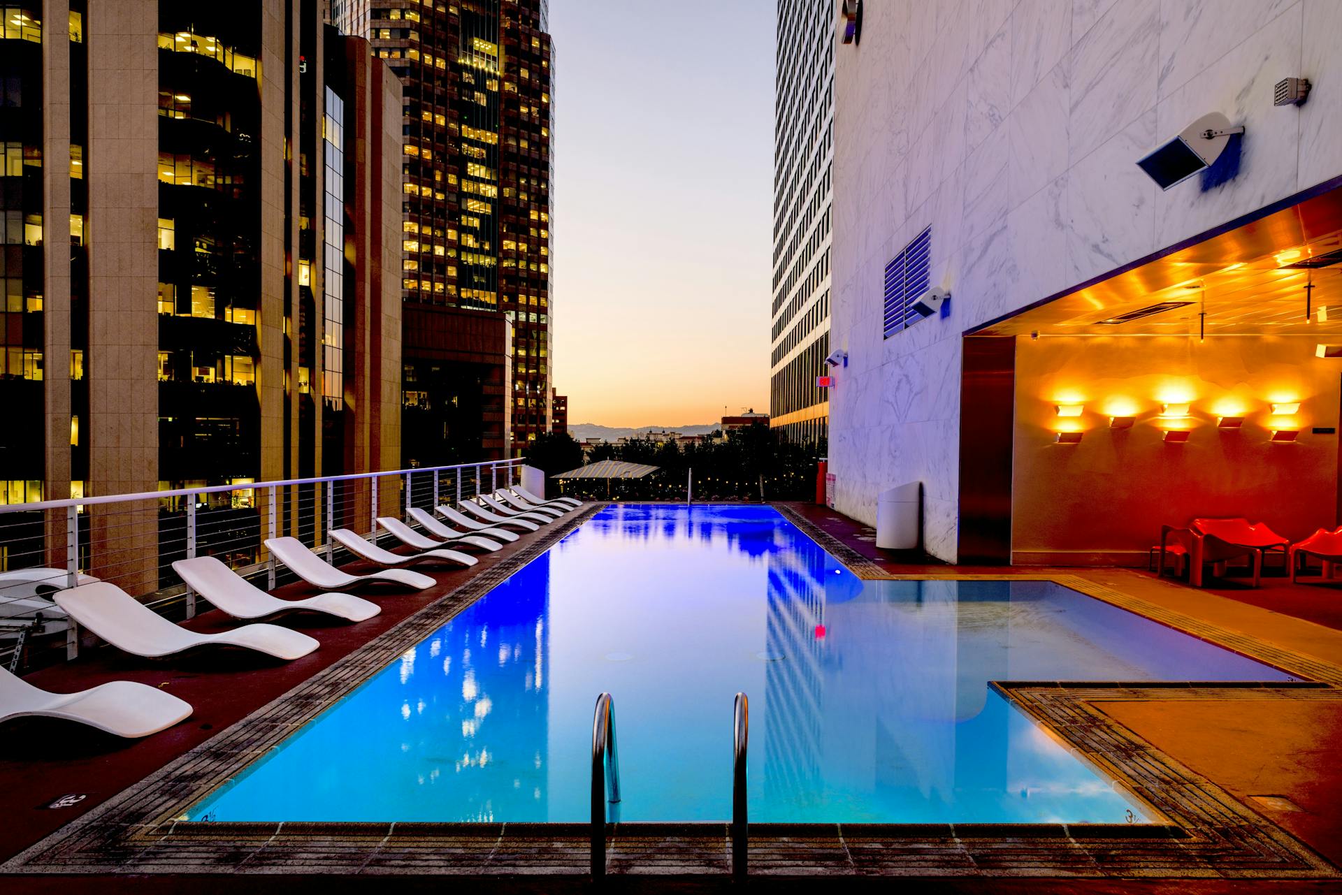 Luxury resort-style swimming pool with lounge chairs