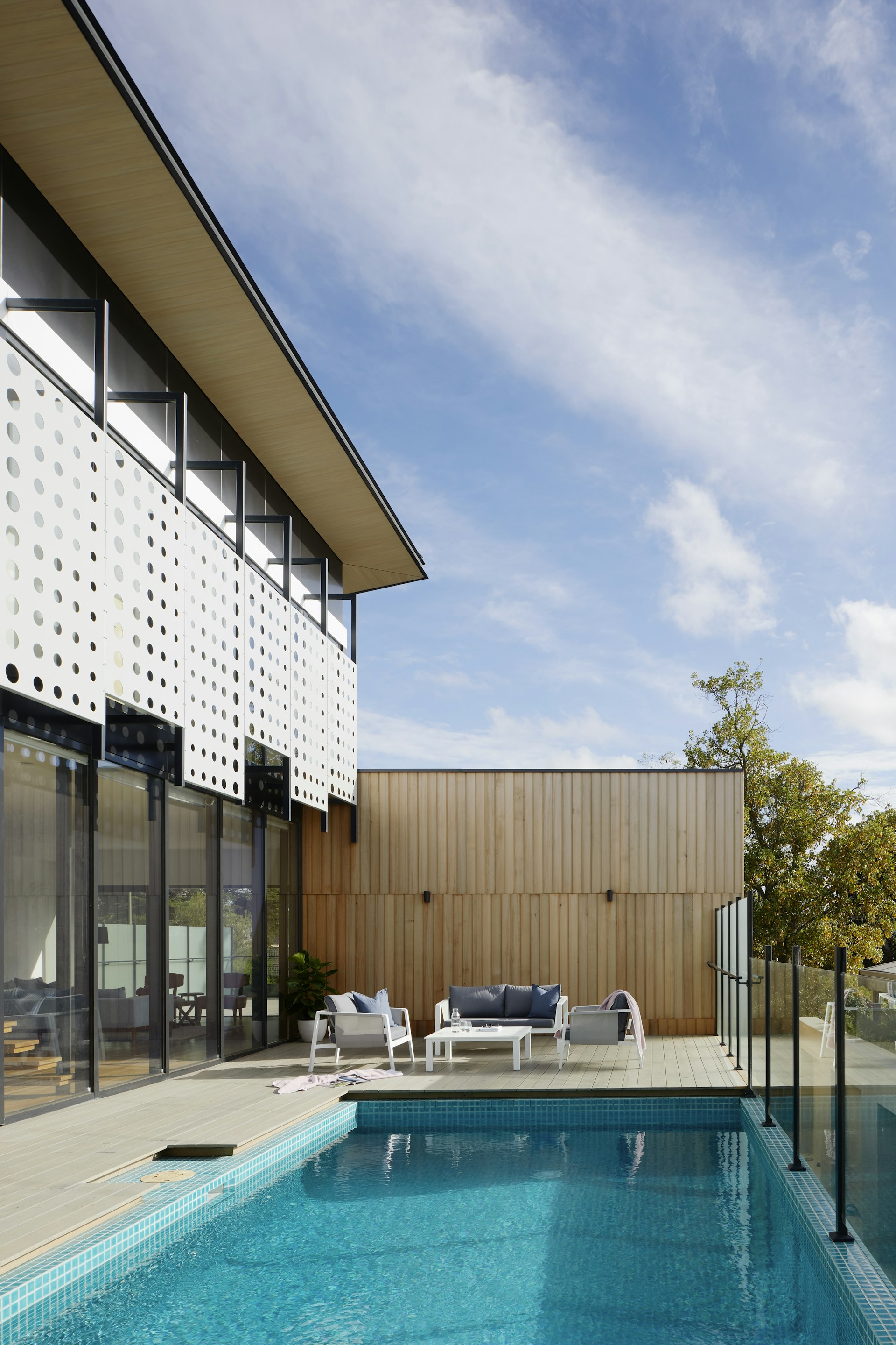 Luxury backyard pool with modern outdoor living space